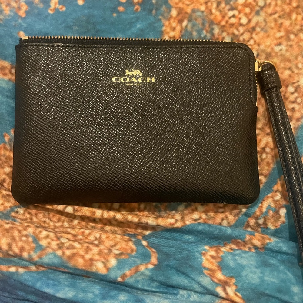 Black coach wristlet. Brand new.